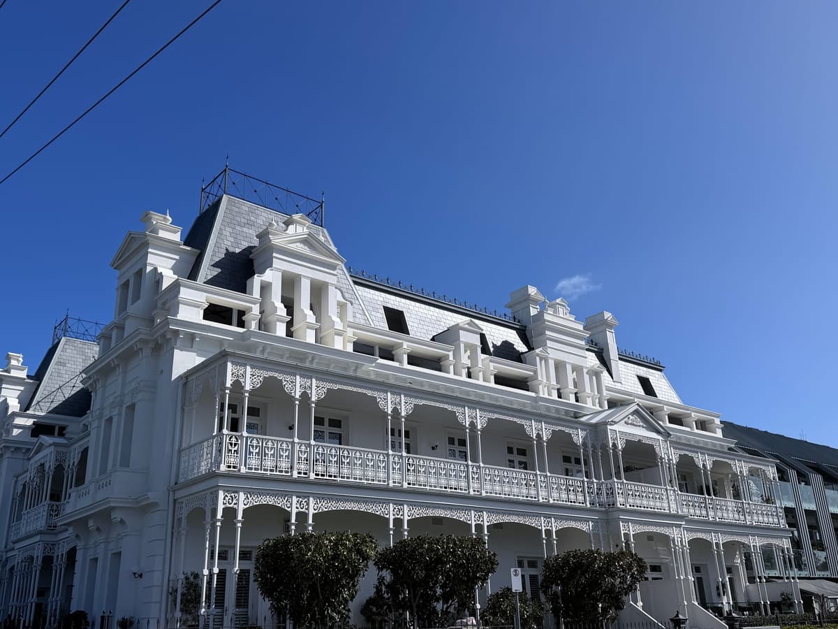 Corner view of the Beaumaris Hotel with its slate roofs and verandahs