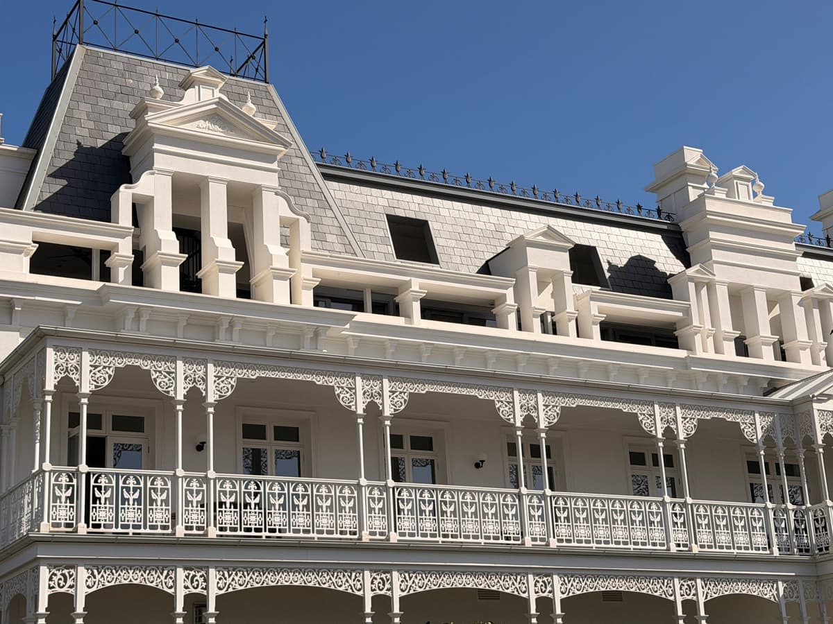 Spanish slate mansard roof above the lacework verandah